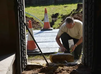 A stonemason gets to work at St Mary's Church Wreay