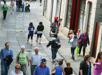 Visitors and shoppers on a street in Stromness