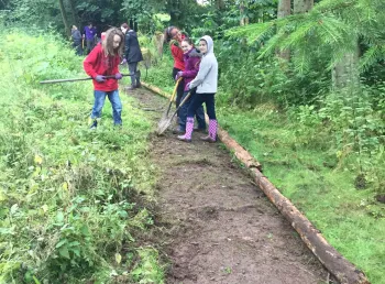 Young people clearing and maintaining paths