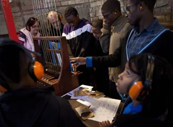 Children learning about the chiming bells
