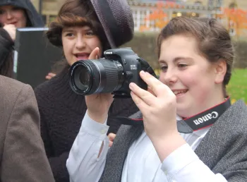 Young people making use of professional photography equipment