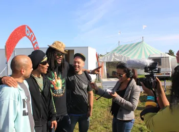 Young people interviewing for the radio station