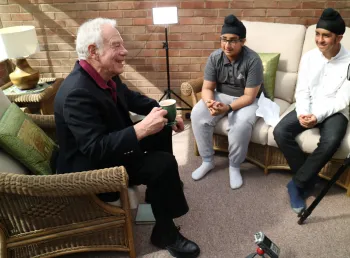 Young hockey players interview older people
