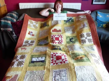 Interviewee Julie Edwards and her quilt