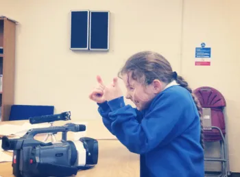 A young Traveller filming stories
