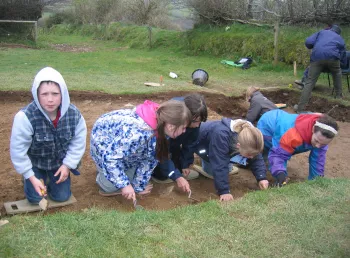 Children take part in an excavation