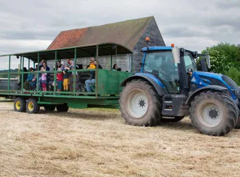 Visitors on the back of a tractor at Woodoaks Farm.
