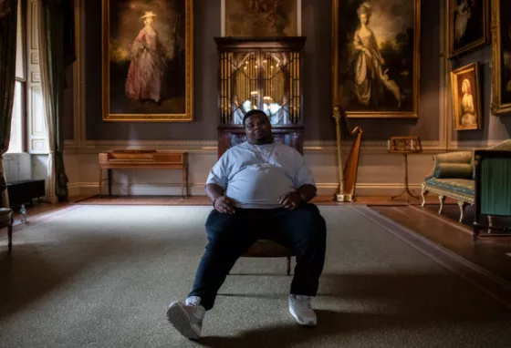 25 years: Stars launch free offers for National Lottery players Big Narstie sitting in Kenwood House