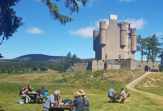 Visitors having picnics outside of Braemar Castle