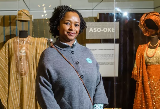 Making real changes in collections development A curator in front of display of African costume