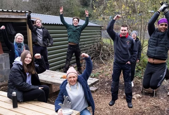 Jumping for joy at the Green Valley Conservation and Heritage Project Happy volunteers at the Green Valley Conservation and Heritage Project