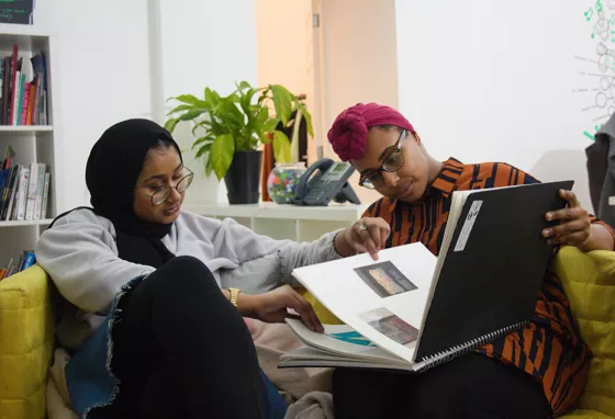 Advice: how to involve young people in heritage Two girls looking at a book