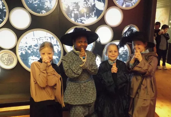 National Lottery Awards 2021 shortlist announced – which project gets your vote? Four children face camera smiling. They are dressed in historic outfits. They are near an exhibition.