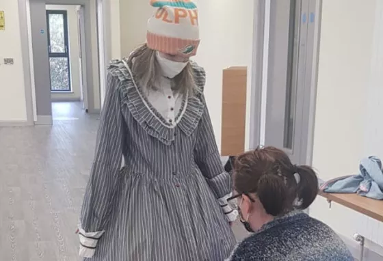 Person getting costume fitted