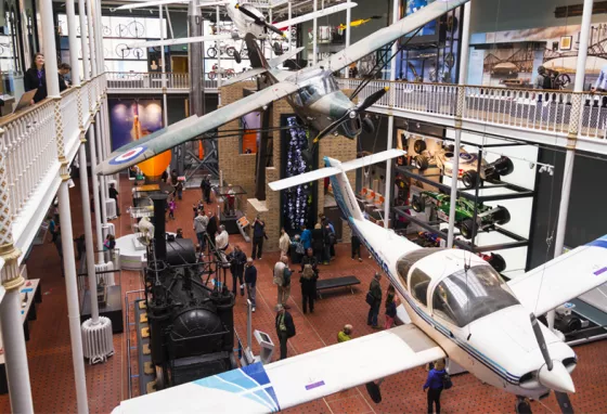 Interior view of the National Museum of Scotland featuring planes suspended from the ceiling