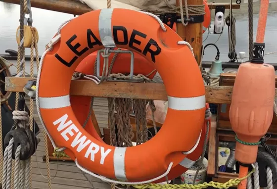 A lifebouy with Leader, Newry written on it, attached to the ship