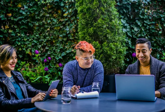 Organisations sought to deliver digital skills projects Three people using laptop and tablet