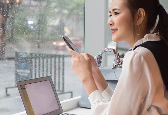 Celebrating two years of Digital Skills for Heritage Woman working digitally