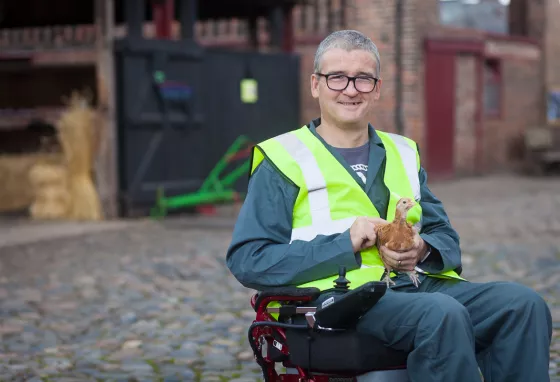 Changing lives: how volunteering helped Nick find purpose again Man with chicken