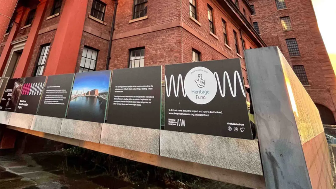 The hoardings barrier has information about the works and features the acknowledgement stamp