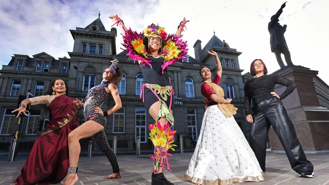 Five dancers strike a pose outside Bradford Arts Centre.