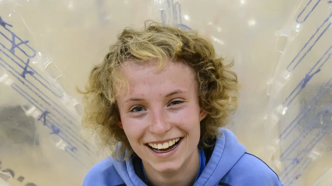 Danielle Pointon in a zorb with a football