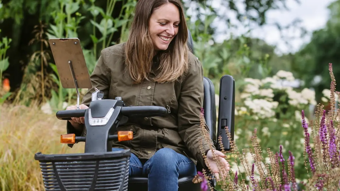 3) A visitor using a mobility scooter in the Wellbeing Garden at RHS Garden Wisley