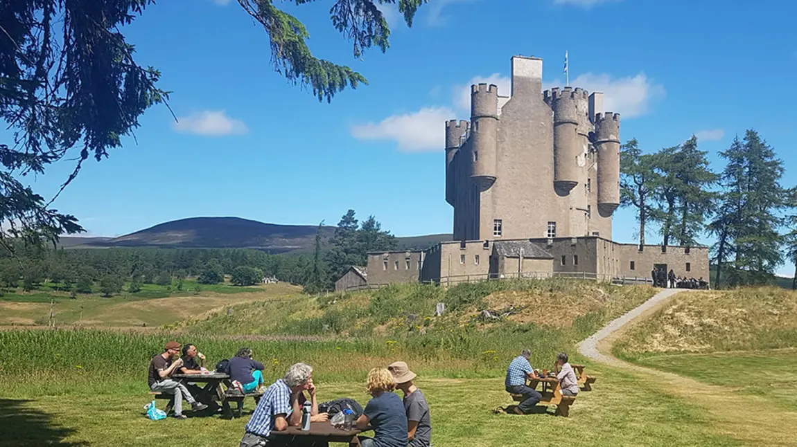Visitors having picnics outside of Braemar Castle 