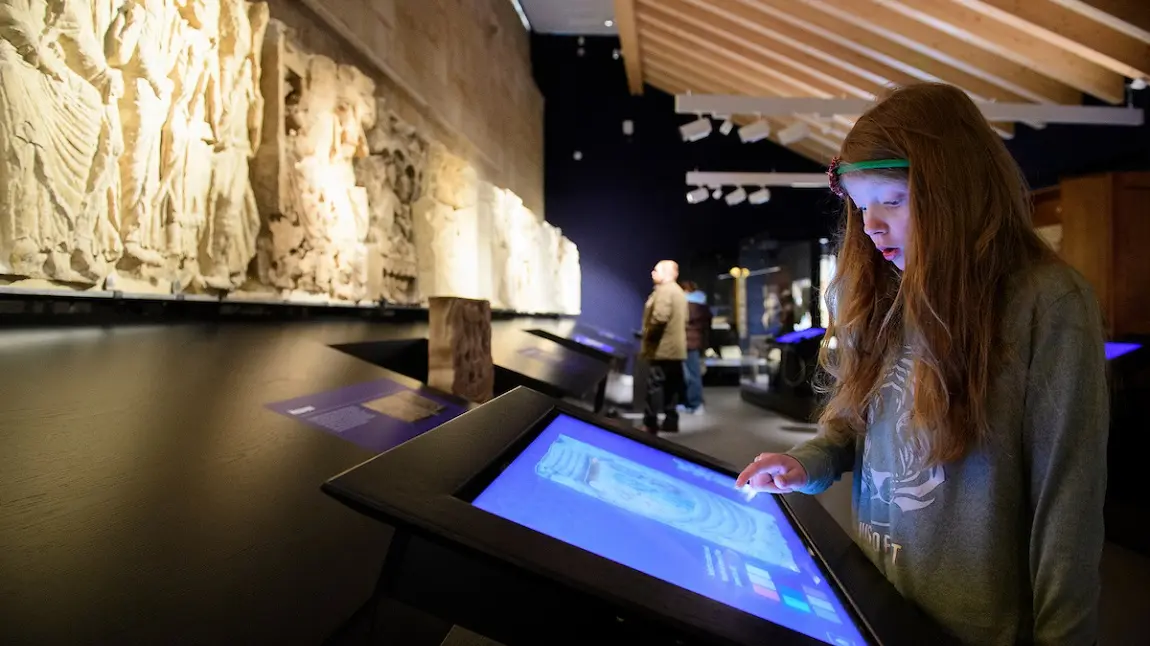 Child using a touch screen in an interactive exhibition 