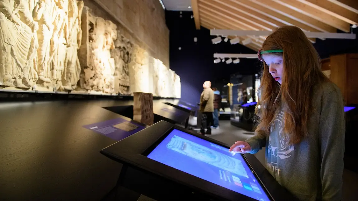 Child using a touch screen in an interactive exhibition