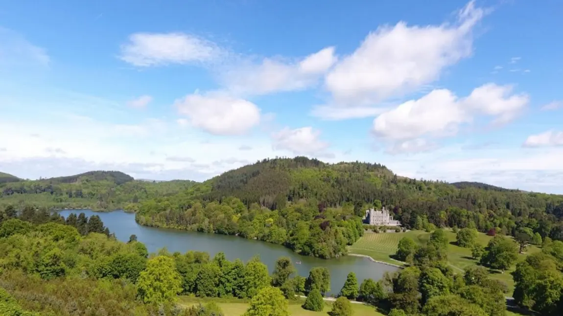 Panoramic view of Castlewellan Forest Park, with lake and castle visible on the hill