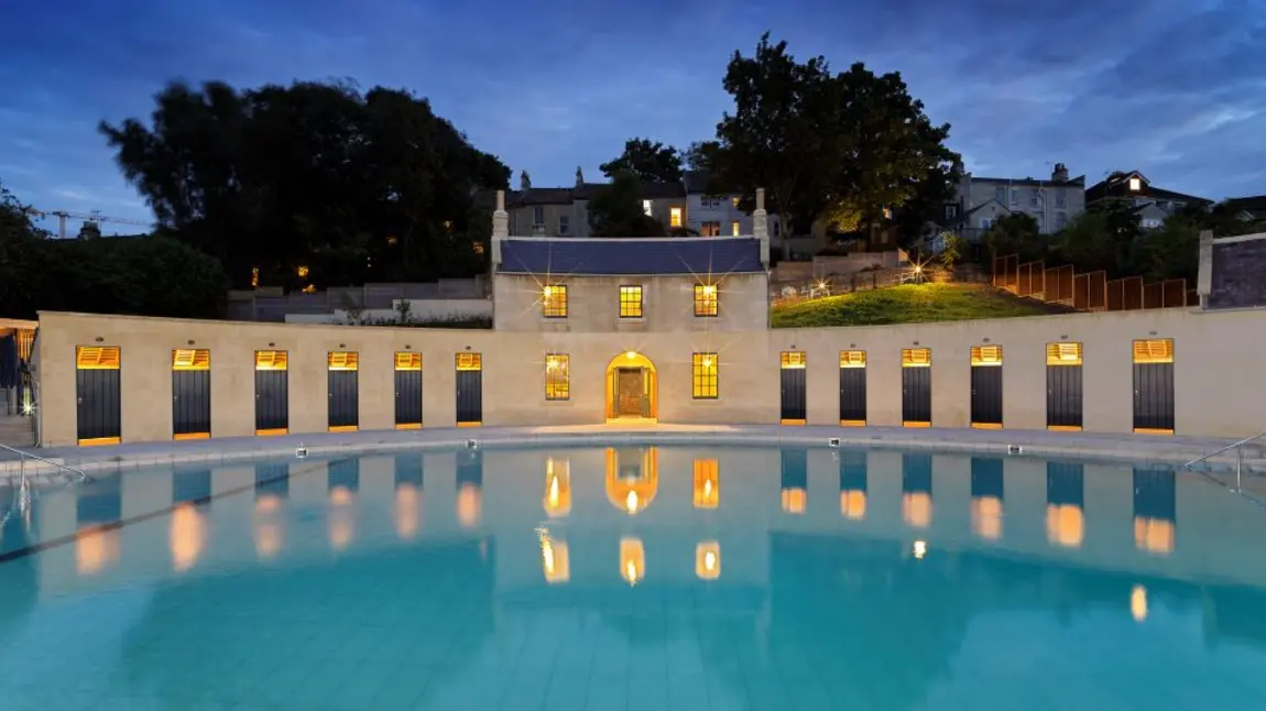 The restored Georgian lido Cleveland Pools in Bath lit up at night