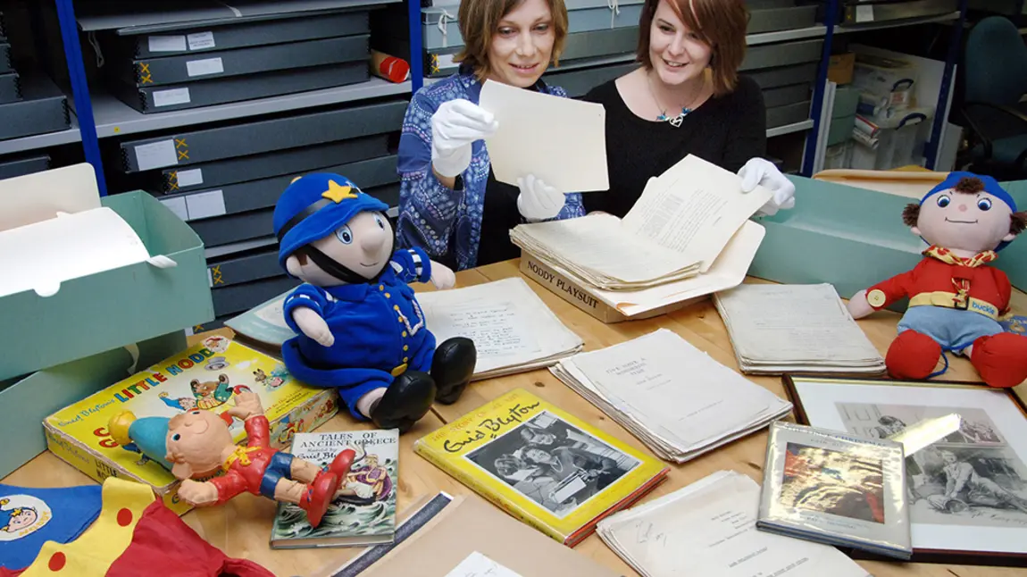 Collections Director Sarah Lawrance and Exhibition Manager Alison Fisher with Enid Blyton archive