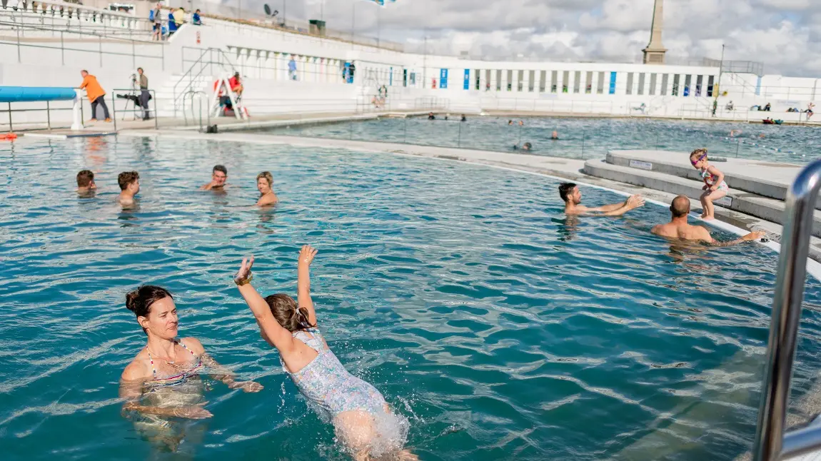 People swimming and playing in the Jubilee Pool