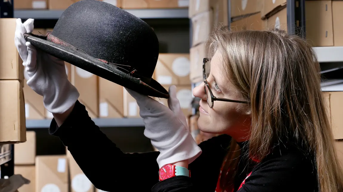 Kerry Vasiliou, Learning and Engagement Manager at the Blackpool Museum Project with Stan Laurel bowler hat