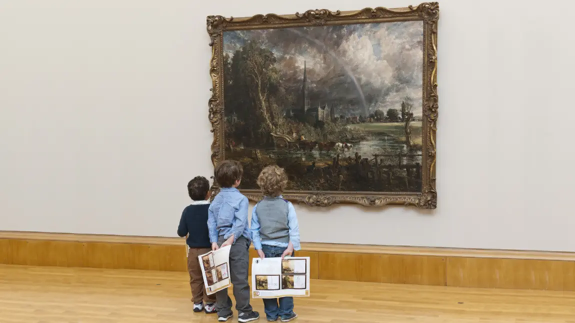 Three children look at Constable painting 
