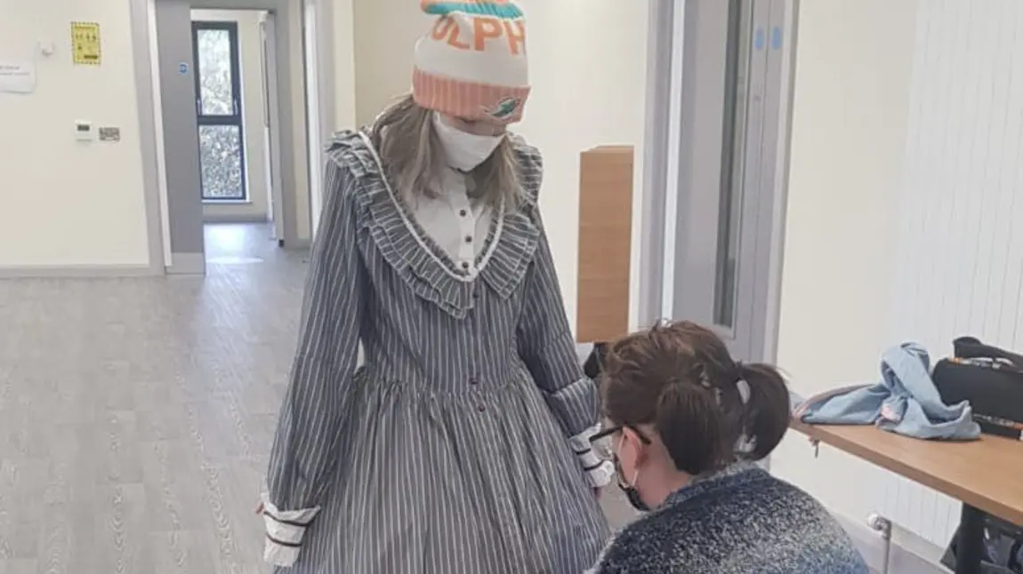 Person getting costume fitted