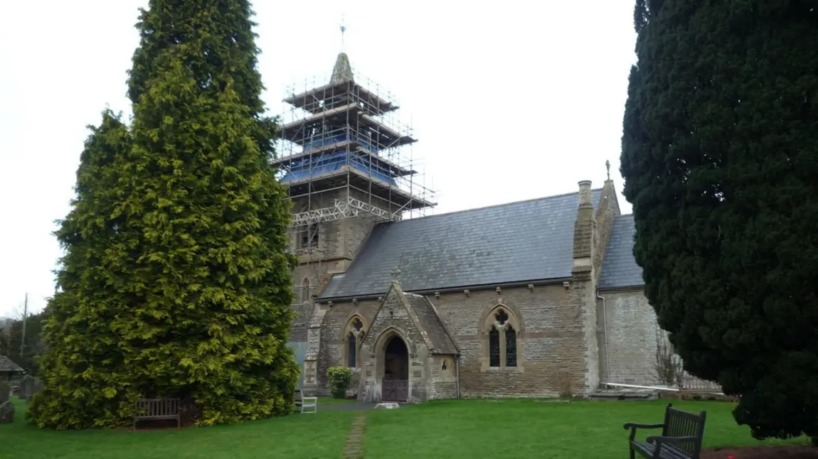 A church with scaffolding on its tower