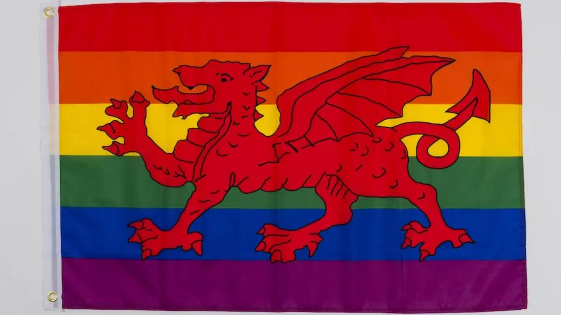 A national Welsh flag with rainbow background.