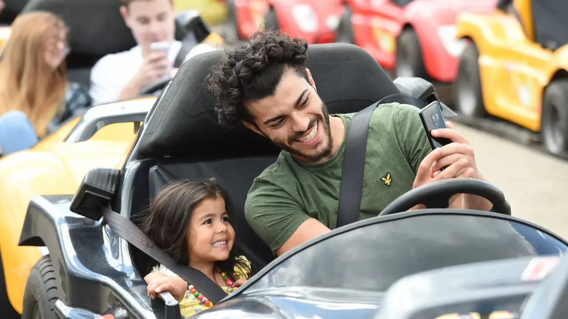 Two people in fairground ride