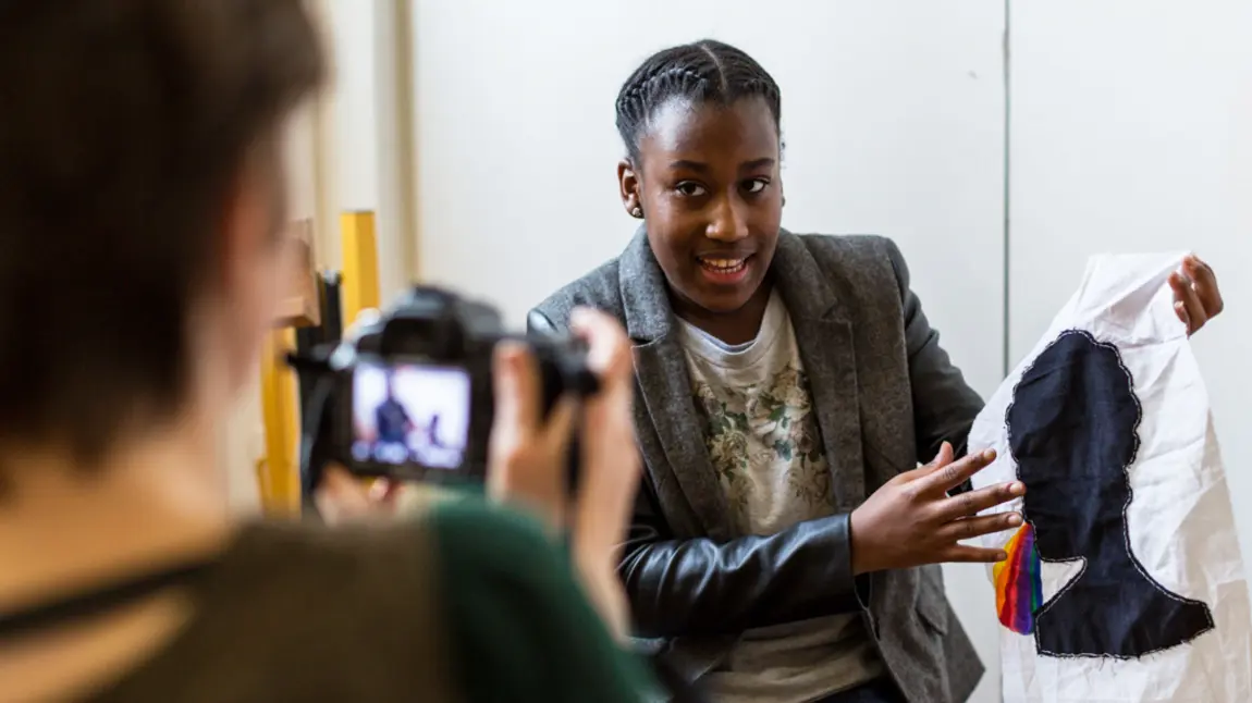 Young woman talks to camera