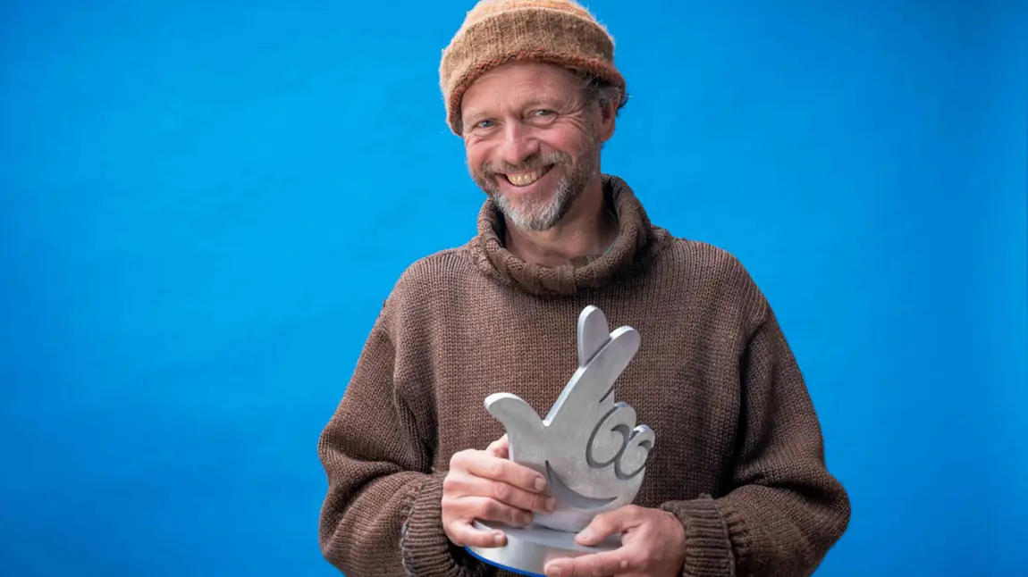 Danny Renton holding his National Lottery Award