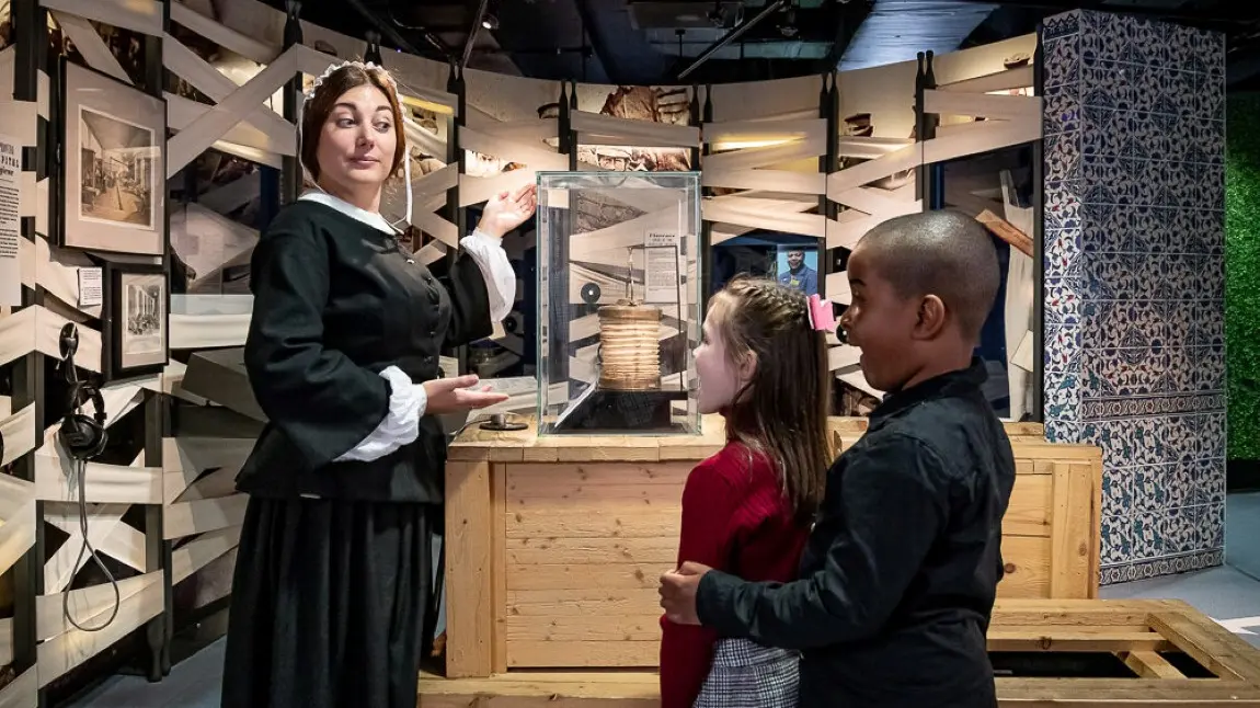 Visitors at Florence Nightingale Museum, which is offering free entry as part of the week. Two young visitors explore the Florence Nightingale Museum, meeting a member of museum staff dressed as Florence in Victorian nurses attire.