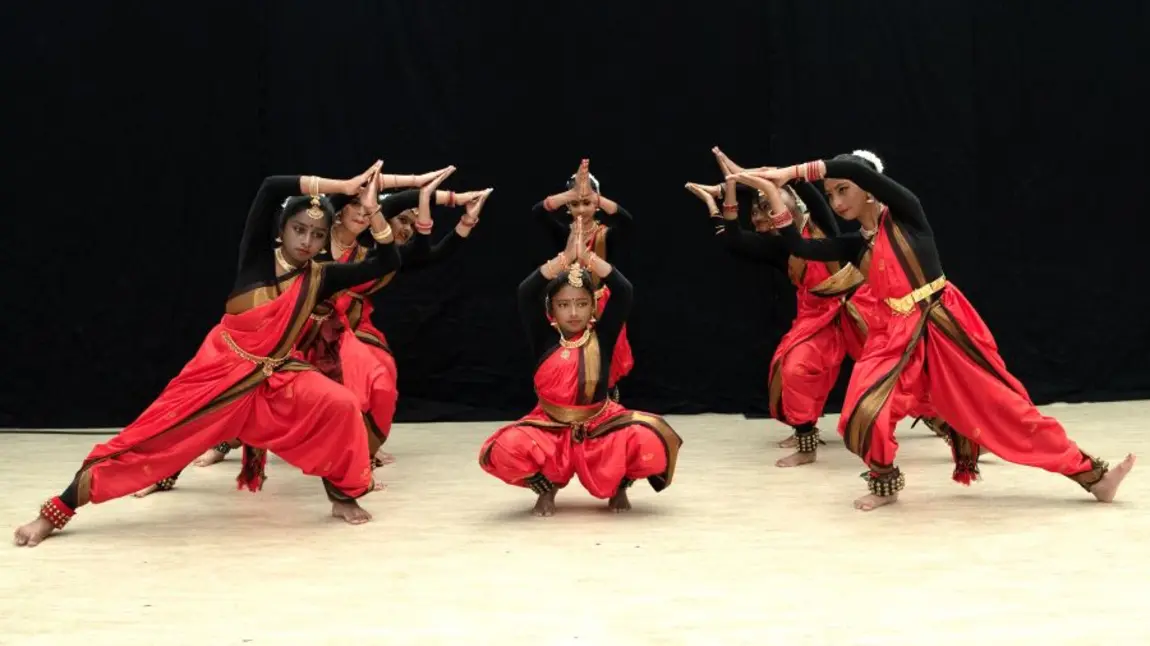 Dancers perform an Indian classical dance called Bharatanatyam at the Global Roots Festival in Knowsley. A group of young people perform an Indian classical dance called Bharatanatyam.