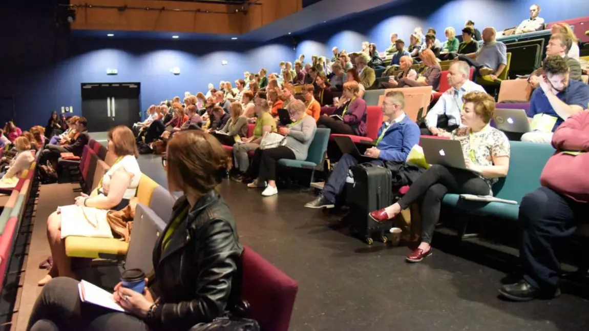 The role of heritage in uncertain times People at a conference