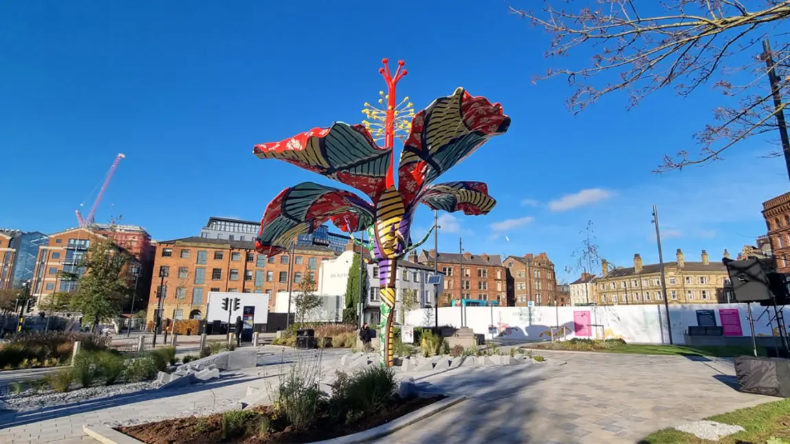 A colourful sculpture of an hibiscus flower