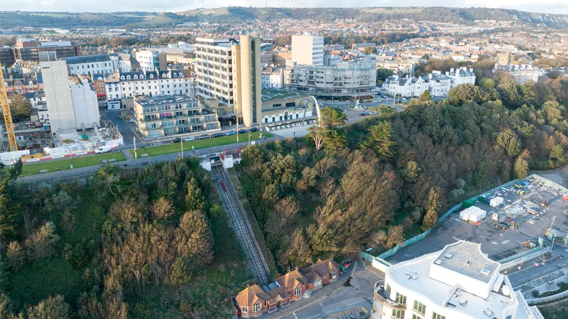 An aerial view of Leas Lift on the cliff edge with town buildings above