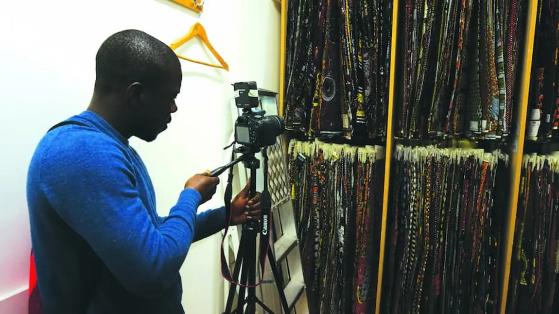 A participant photographing wax prints