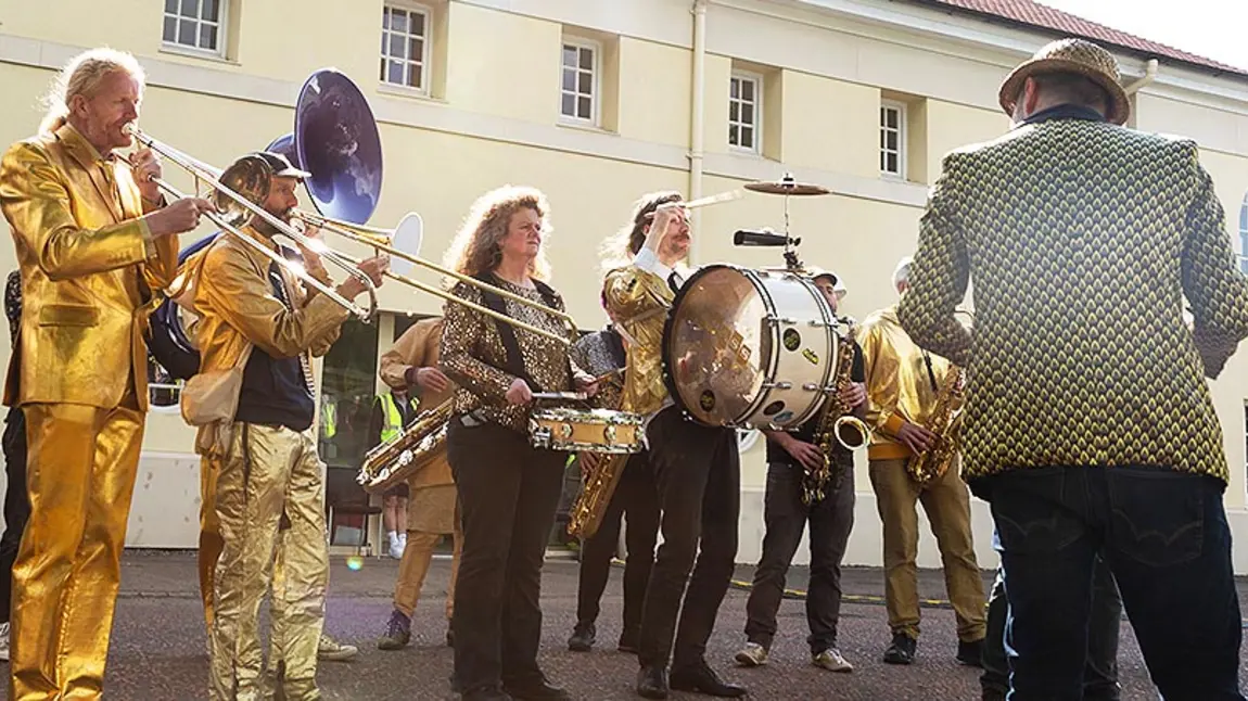 People are together playing instruments outside