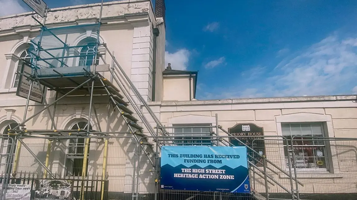 The exterior of a historic building with scaffolding on it.